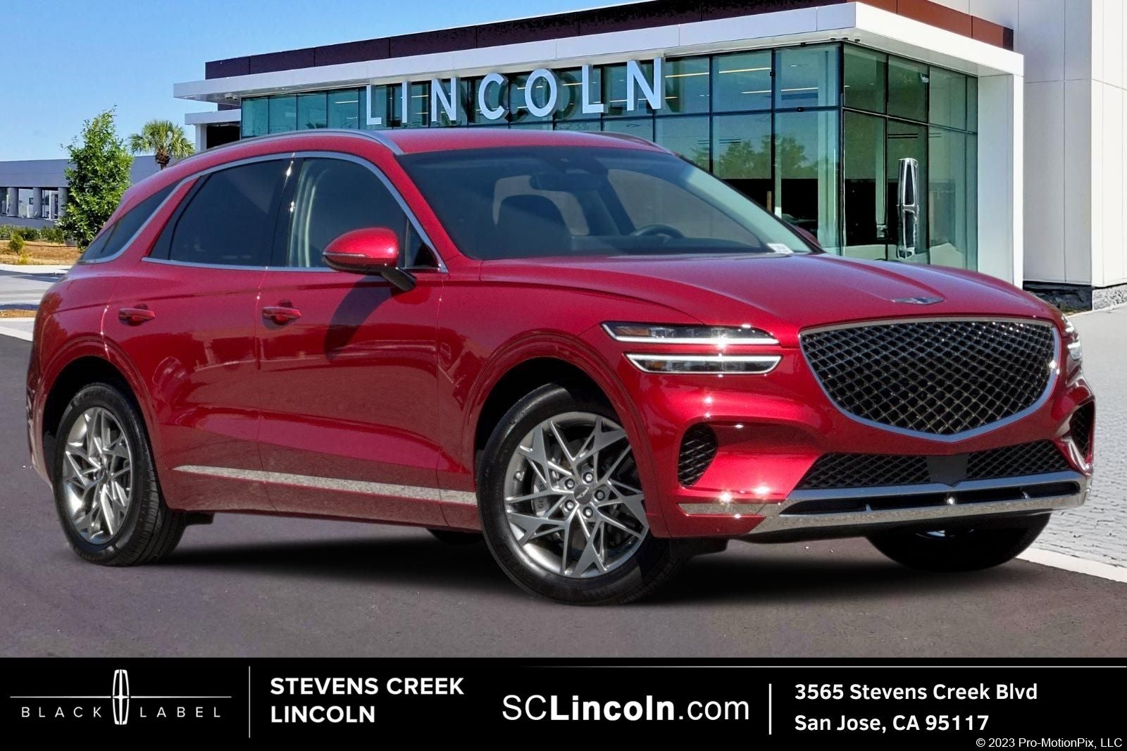 2025 Genesis GV70 2.5T in Mauna Red — front three-quarter view