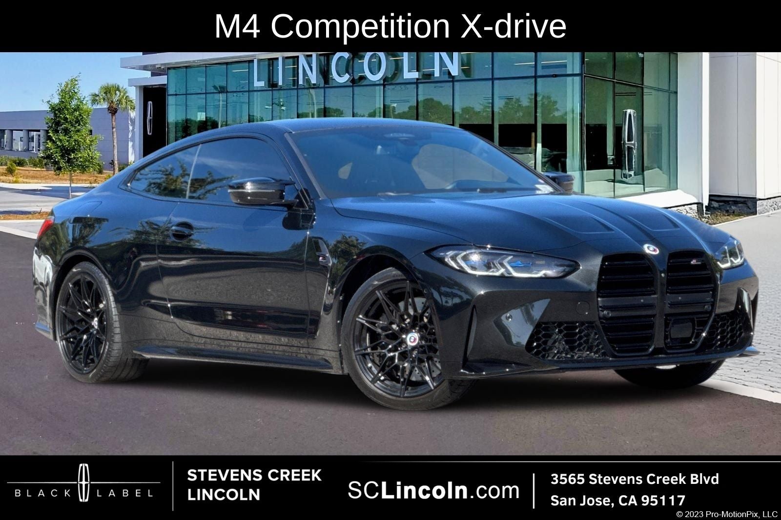 2023 BMW M4 Competition in Black Sapphire Metallic — front three-quarter view