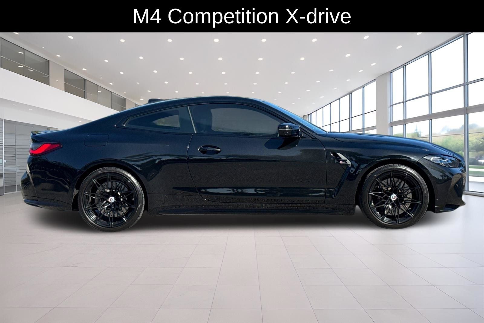 2023 BMW M4 — rear three-quarter view